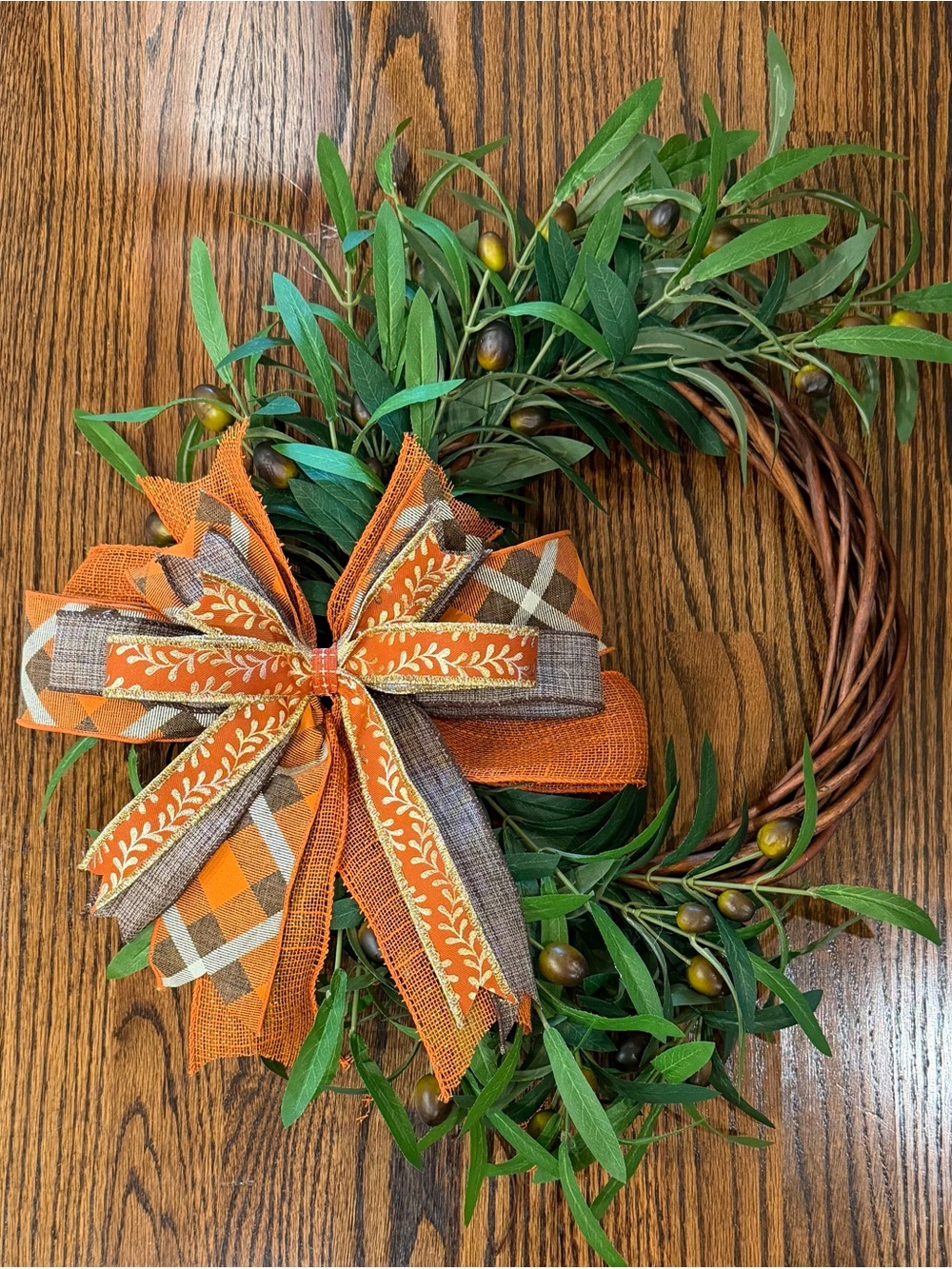 Olive Leaf Holiday Wreath with Orange Plaid Bow